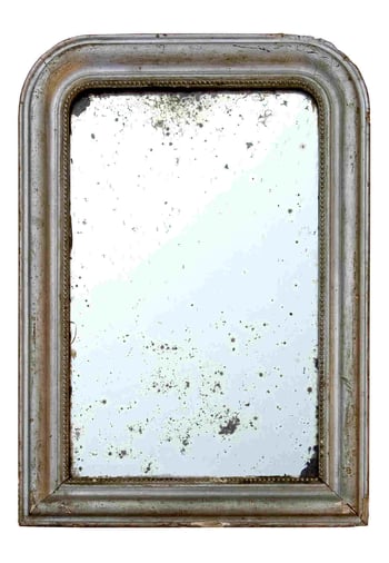 Antique mirror featuring black edges and spots from improper cleaning techniques